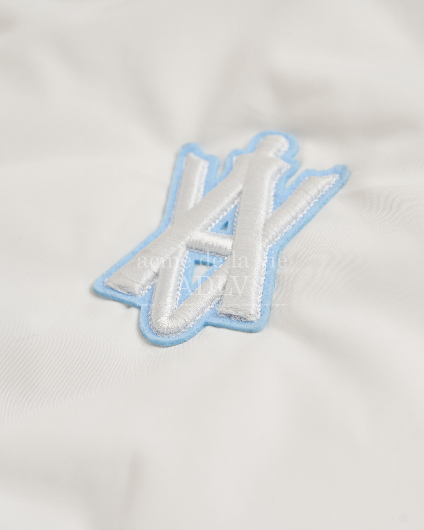 REVERSIBLE A LOGO EMBLEM FAKE FUR JACKET SKY BLUE