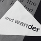 AND WANDER REFLECTIVE LOGO TEE (BLACK)