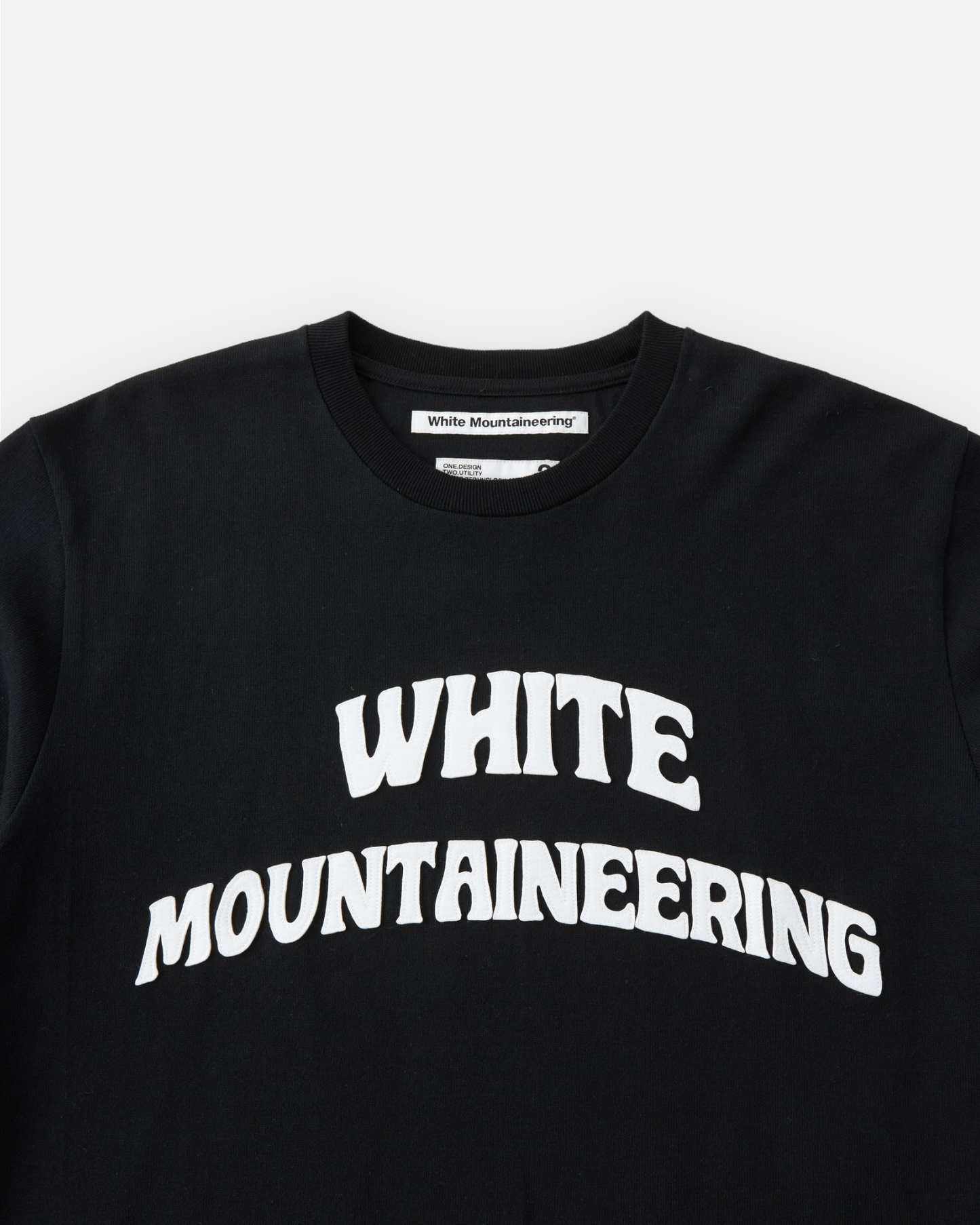 WHITE MOUNTAINEERING LOGO APPLIQUED L/S T-SHIRT (BLACK)